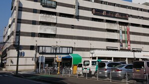 A multi-story hotel with a modern design, featuring a prominent sign in both Japanese and English. - Mihara Kokusai Hotel (Mihara)