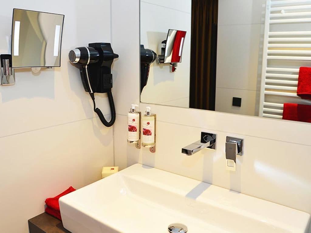 shower, hair dryer, bathrobes, slippers