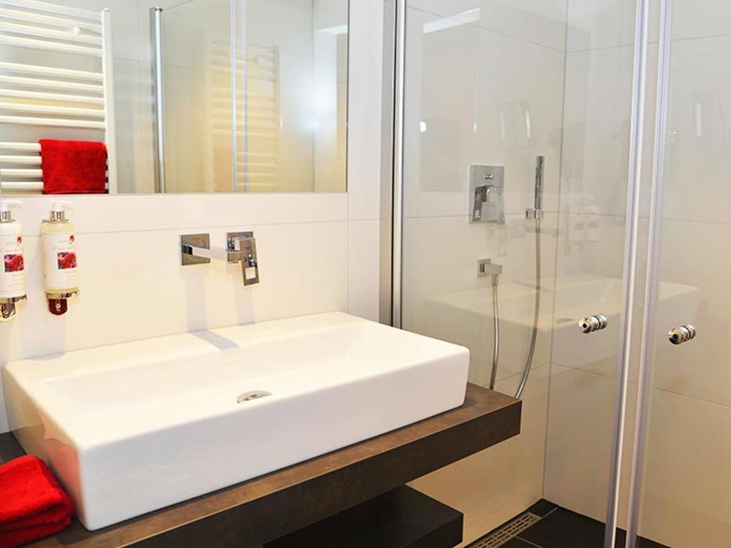 shower, hair dryer, bathrobes, slippers