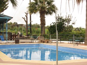 Seasonal outdoor pool, pool umbrellas, pool loungers