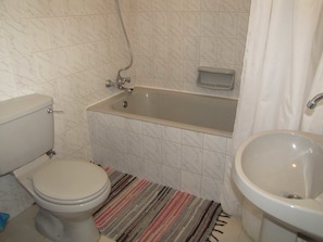 Apartment, 1 Bedroom, Pool Access | Bathroom | Bathtub, hair dryer, towels, soap