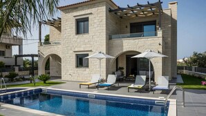 A modern two-story house with a swimming pool, outdoor seating, and a pergola. - Villa 200m to Beach & Amenities w/Pool, Sauna, BBQ (Αλμυρίδα)