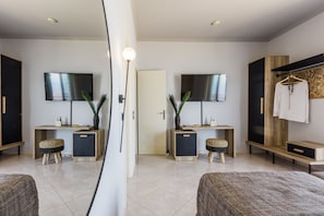 A modern hotel room with a large mirror, two TV screens, a wardrobe, a bedside table, and a bed. - Villa with private pool - endless sea view / mountain view - Villa Di Capri (Unknown)