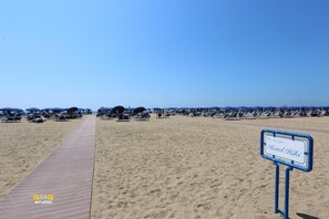 Private beach, white sand, sun loungers, beach umbrellas