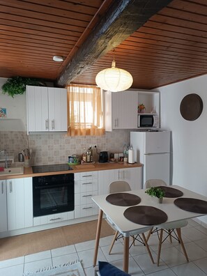 Fridge, electric kettle, toaster, cookware/dishes/utensils
