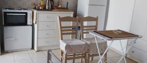 Fridge, electric kettle, toaster, cookware/dishes/utensils