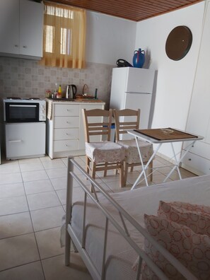 Fridge, electric kettle, toaster, cookware/dishes/utensils