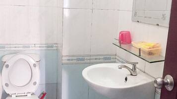 Shower, slippers, towels, soap