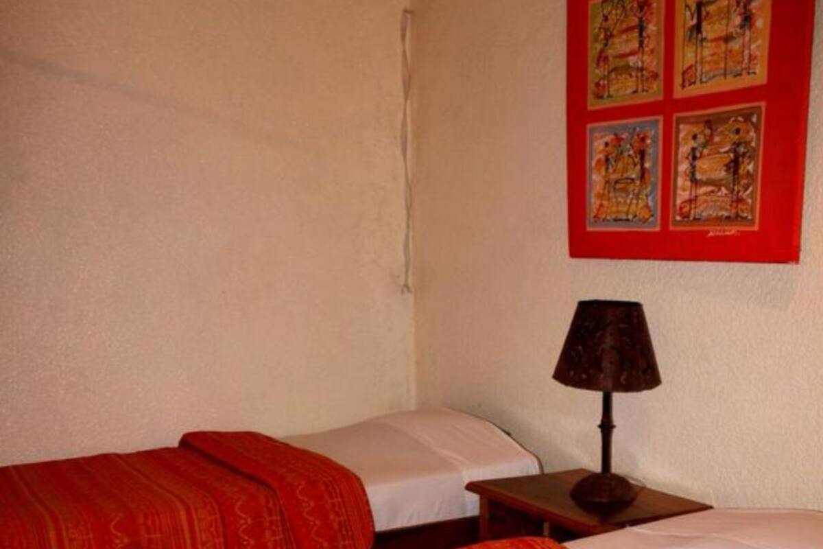 Standard Quadruple Room, Garden View | In-room safe, iron/ironing board, free WiFi, bed sheets