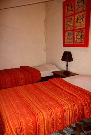 Standard Quadruple Room, Garden View | In-room safe, iron/ironing board, free WiFi, bed sheets