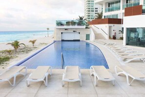 2 outdoor pools, open 8:00 AM to 10:00 PM, pool umbrellas, sun loungers - Condominio Girasol by Ocean Dream (Cancun)