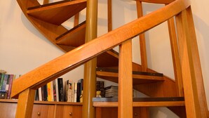 A wooden spiral staircase with a marble-topped landing. - Luxury apart. w/ spectacular views (Loutraki-Korinthias)