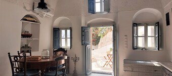 House of the Seven Ships. Cycladic traditional house with sea and sunset view 