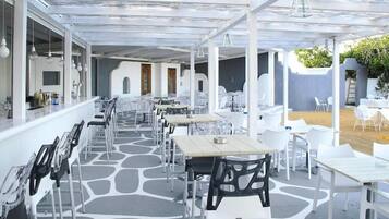 Outdoor pool, open 10:00 AM to 7:00 PM, pool umbrellas