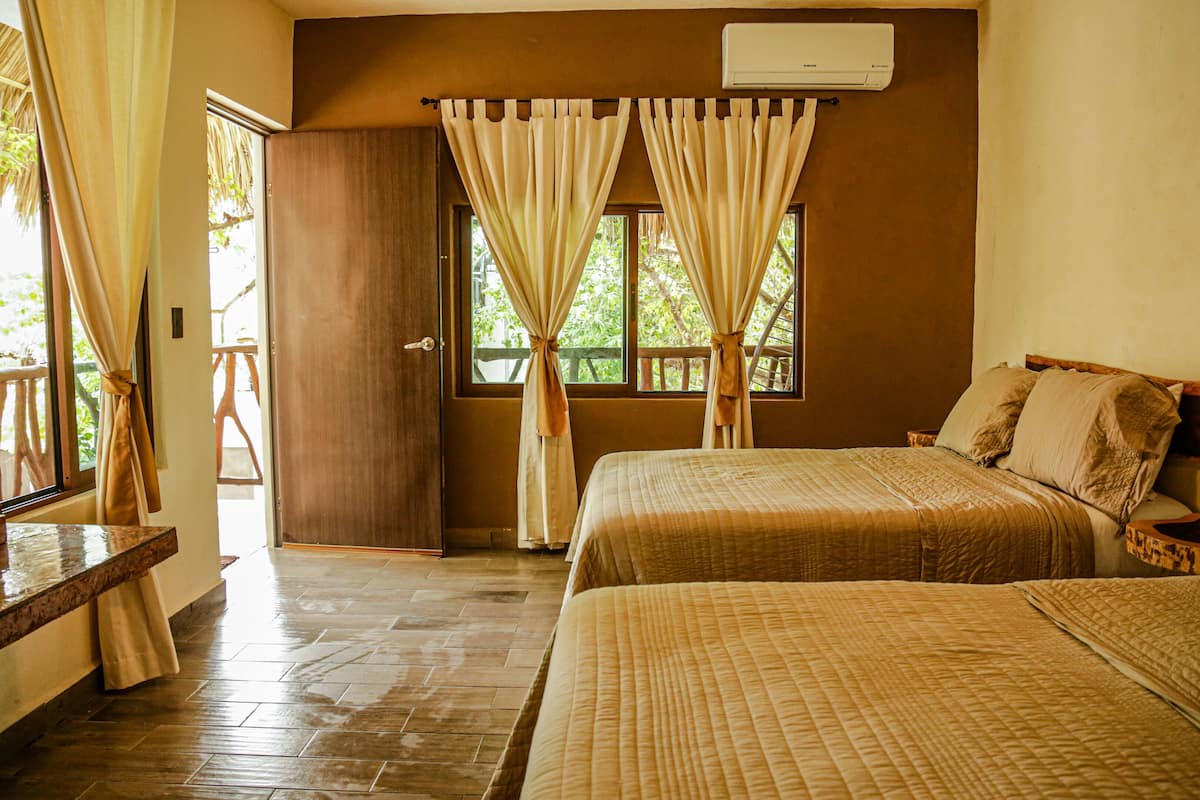 superior room, 2 double beds | minibar, in-room safe, free cots/infant beds, travel cot