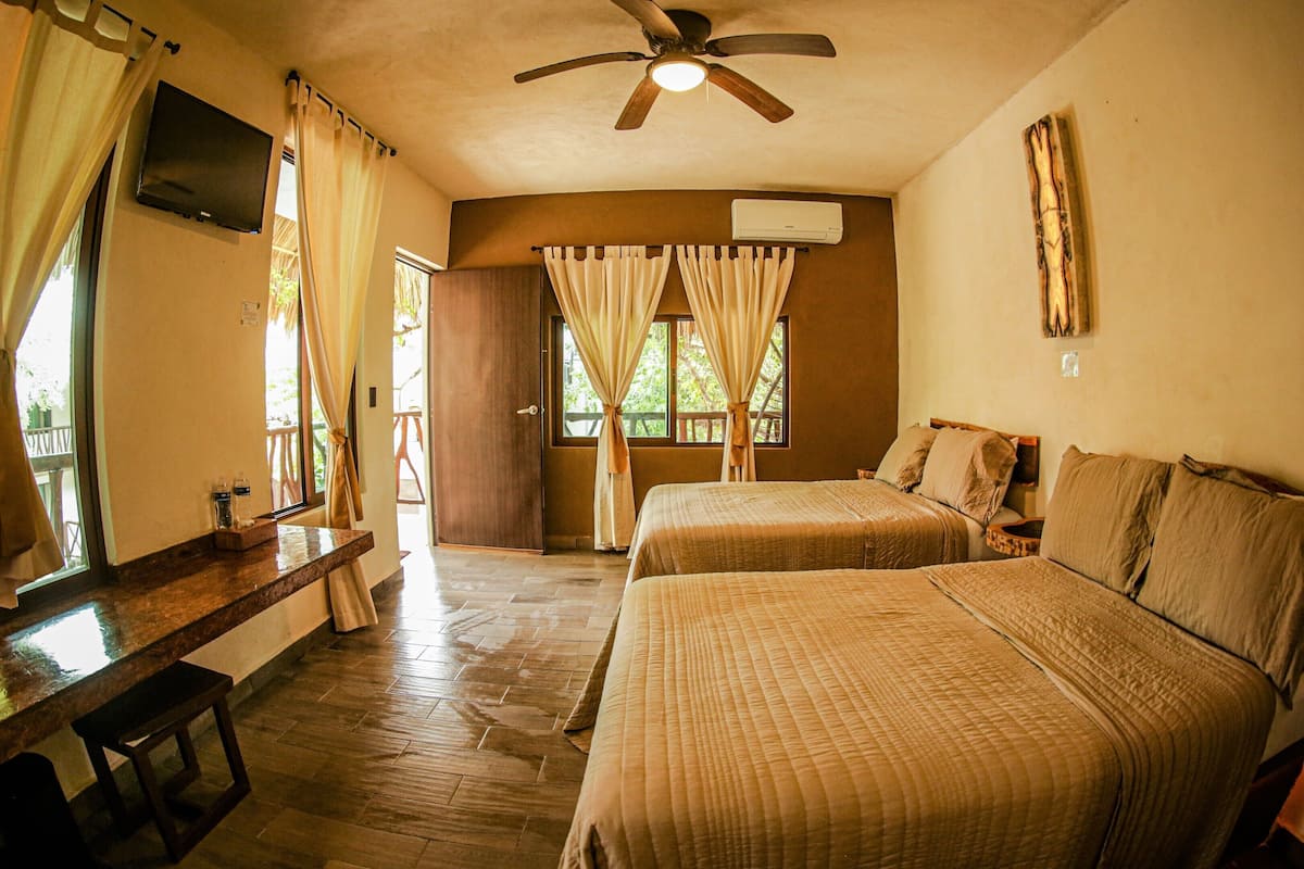 superior room, 2 double beds | minibar, in-room safe, free cots/infant beds, travel cot