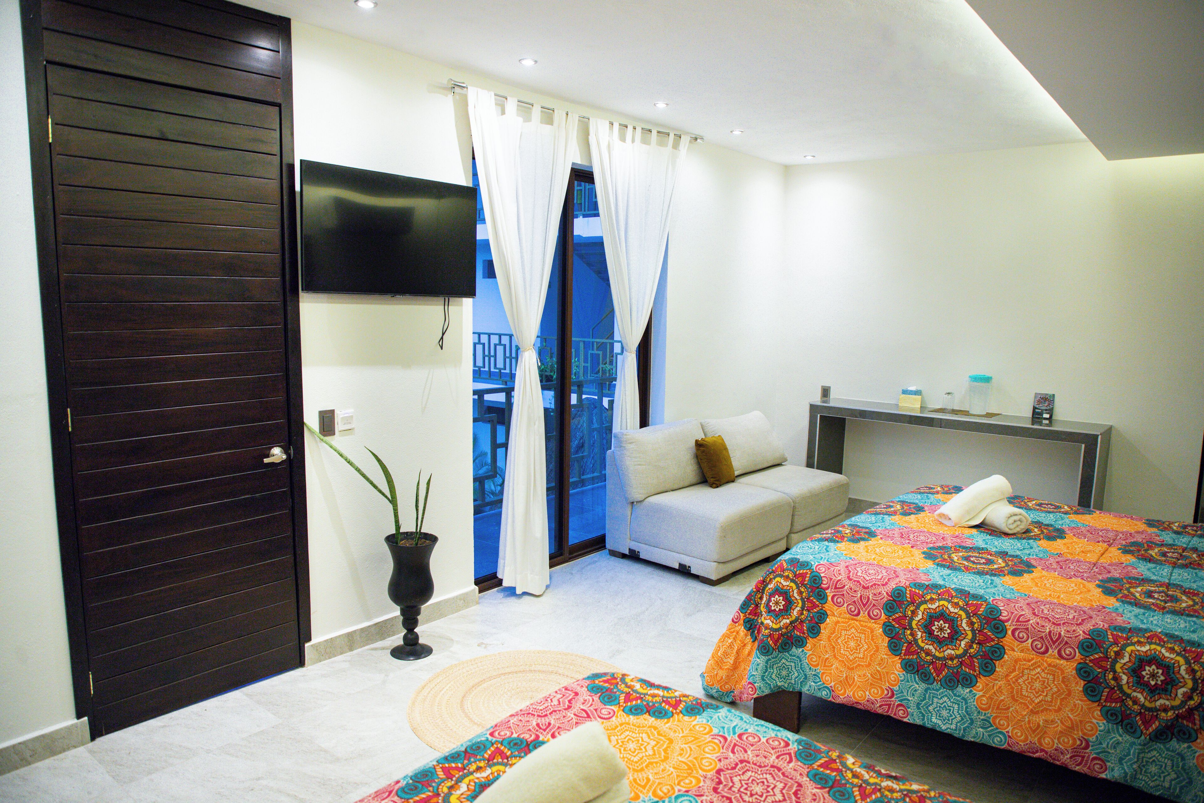 Deluxe Room, Multiple Beds | Minibar, in-room safe, free cribs/infant beds, travel crib