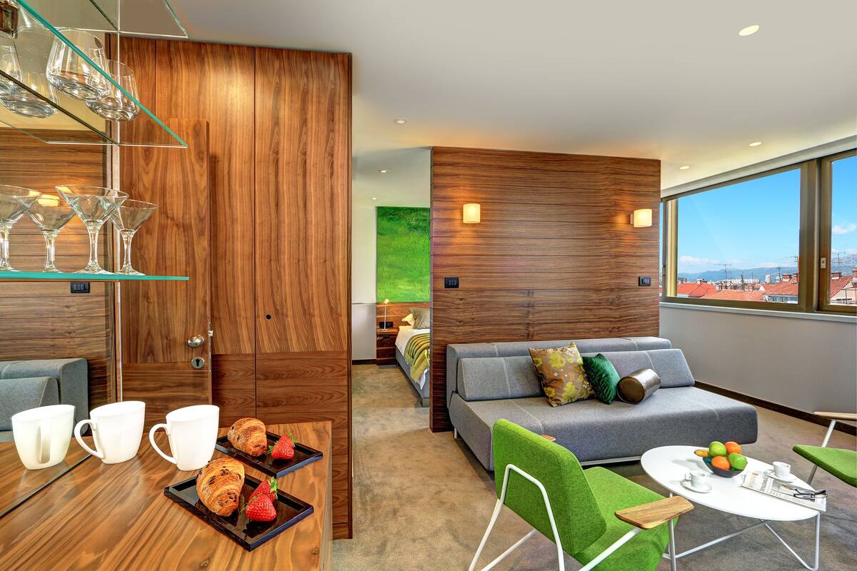 Superior Suite, City View | Living area | Flat-screen TV