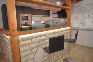 Panoramic Villa, Sea View | Private kitchen | Full-size fridge, microwave, oven, stovetop