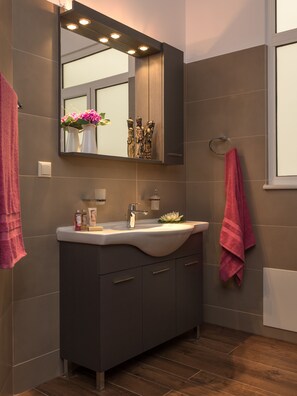 Bathtub, hair dryer, towels, soap