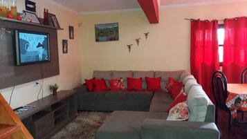 Family Duplex, Multiple Beds | Living room | 32-inch Smart TV with cable channels, TV, Netflix