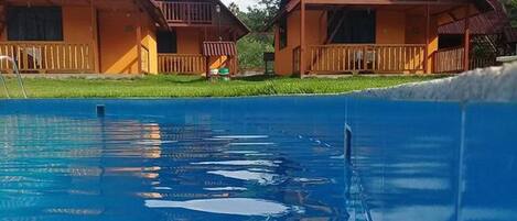 Outdoor pool, pool umbrellas, pool loungers