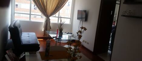 Family Apartment, 3 Bedrooms | Living room | Flat-screen TV