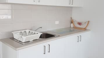 Comfort Apartment, 1 Bedroom | Private kitchen | Coffee/tea maker, electric kettle, toaster, dining tables