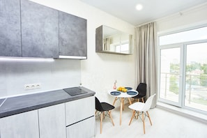 Full-sized fridge, microwave, stovetop, electric kettle