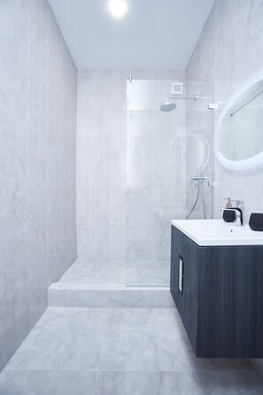 Shower, hair dryer, towels, soap