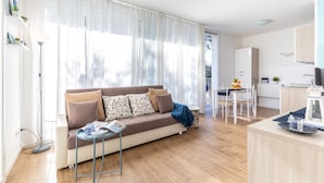 Apartemen, 2 kamar tidur | Area keluarga | TV layar datar