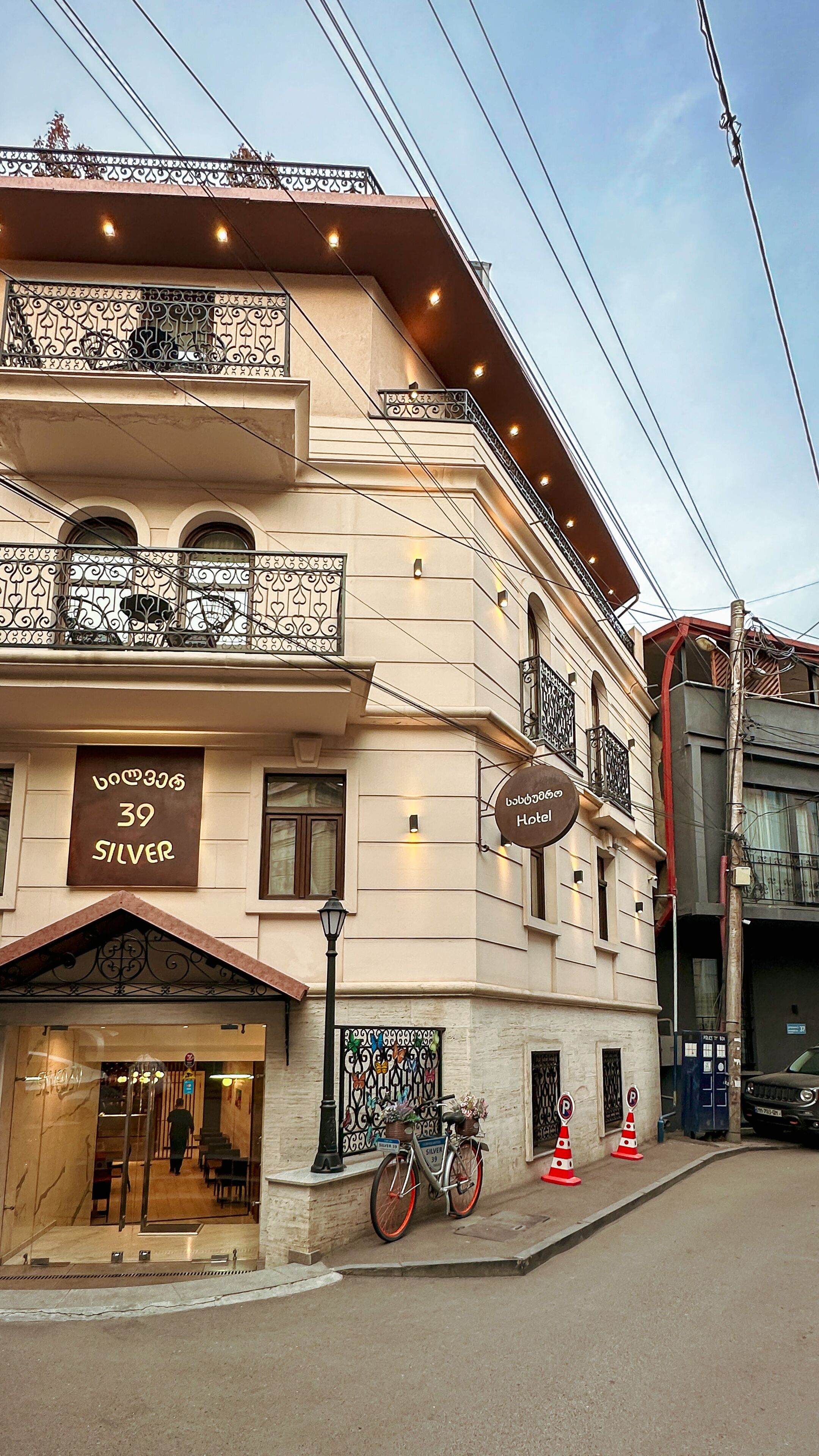 A hotel with a sign reading "39 SILVER" and "Hotel" in a foreign script.