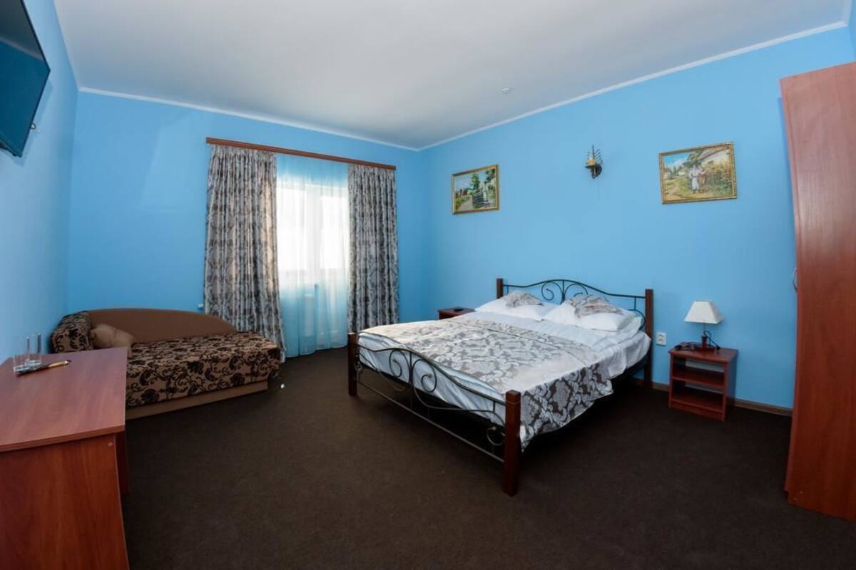 Habitación cuádruple | Tabla de planchar con plancha, camas extra y wifi gratis 