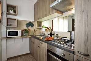 Apartment, 2 Bedrooms | Private kitchen | Cookware/dishes/utensils - Casa di Zio Mario A (Baunei)