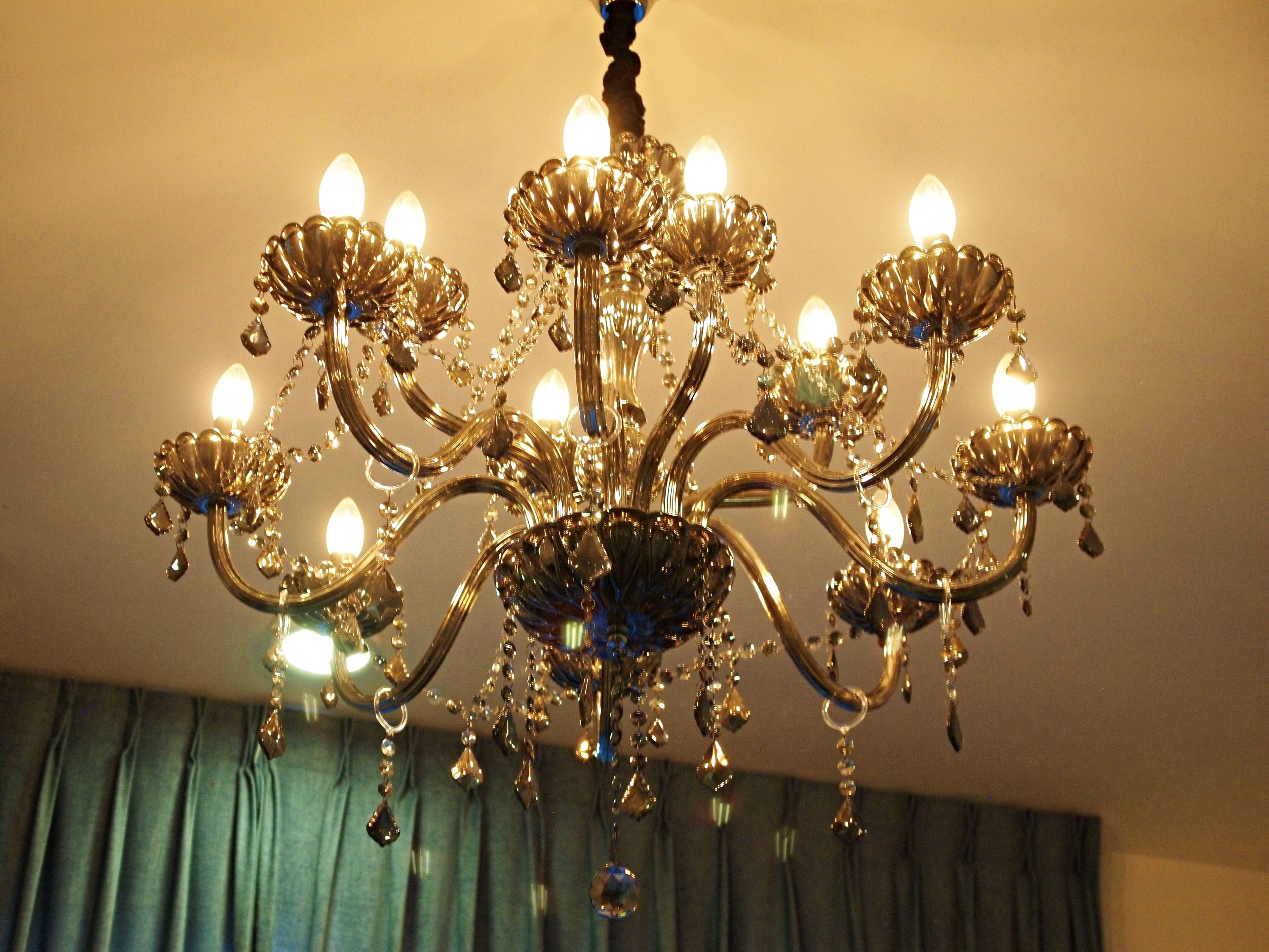 A chandelier with multiple arms and lights.