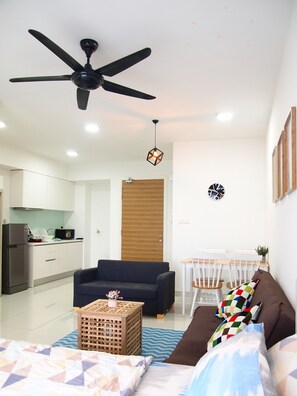 The Natural Suites | Living area | Flat-screen TV