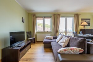 Apartment, 1 Bedroom | Living area | Flat-screen TV