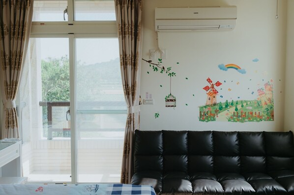 Deluxe Triple Room, Balcony, Courtyard Area | Living area | LCD TV