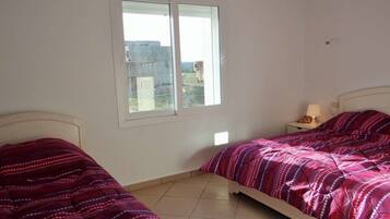 Apartment, 1 Bedroom, City View | Blackout drapes, free cribs/infant beds, free WiFi, bed sheets