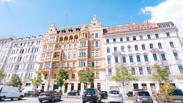 A multi-story building with classical architecture, featuring arched windows and decorative elements. - My City Apartments am Naschmarkt (Vienna)