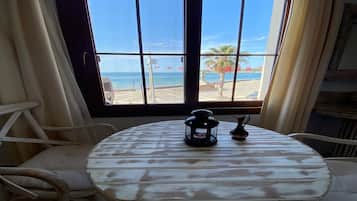 Deluxe Room, Sea View | 1 bedroom, premium bedding, free minibar items, in-room safe