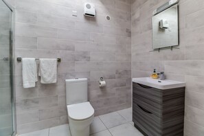 Shower, hair dryer, towels