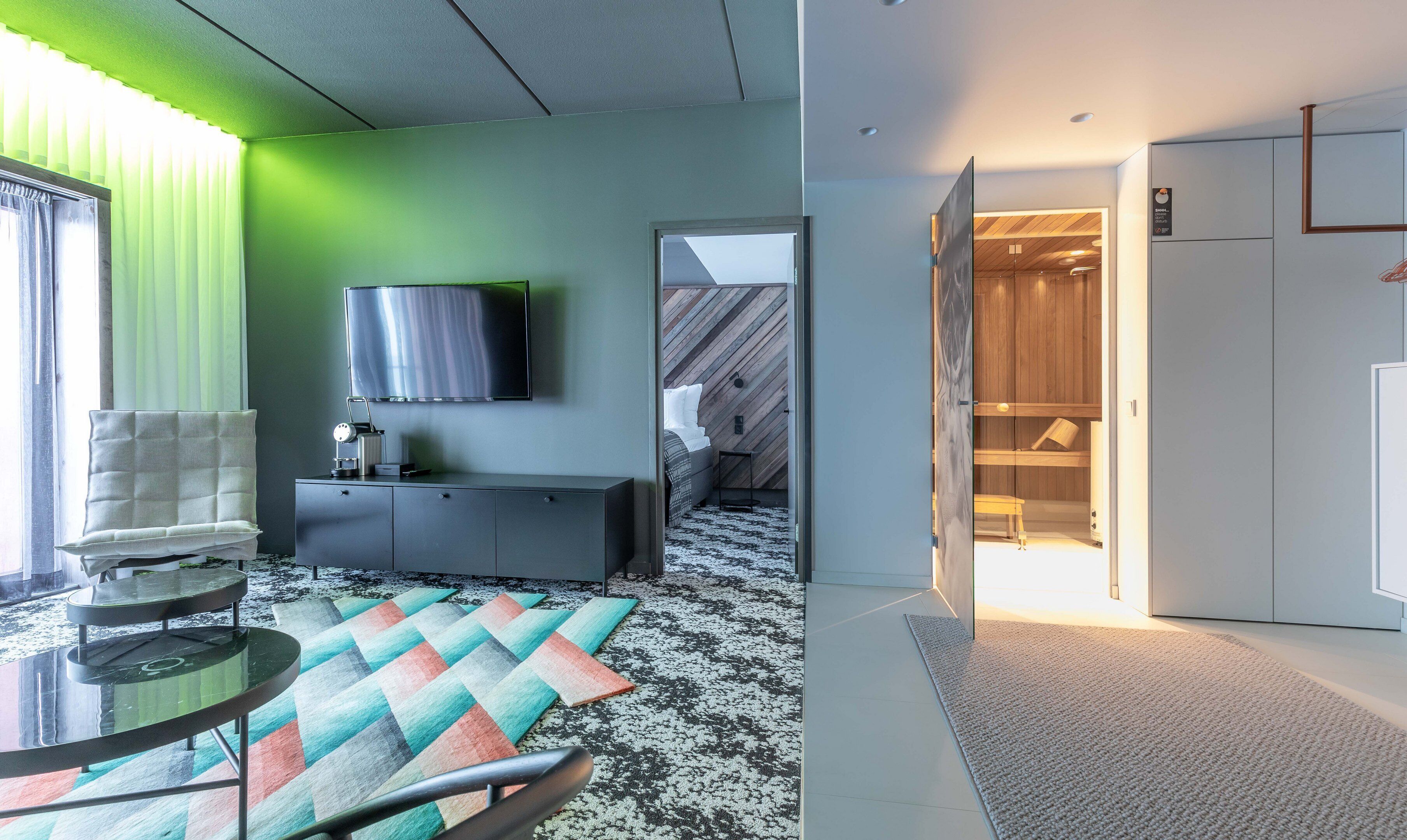 deluxe suite | living area | flat-screen tv