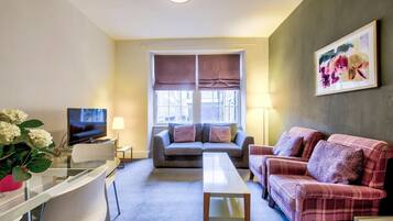 Apartment (1 Bedroom) | Living area | TV