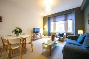 Apartment (1 Bedroom) | Living room | 24-inch flat-screen TV with cable channels