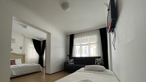 Economy Quadruple Room | 1 bedroom, desk, WiFi (free), bed sheets - Caunos Antik Hotel (Ortaca)