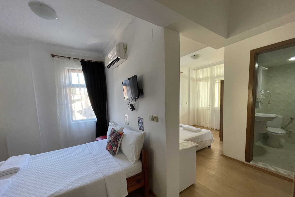Economy Quadruple Room | 1 bedroom, desk, WiFi (free), bed sheets
