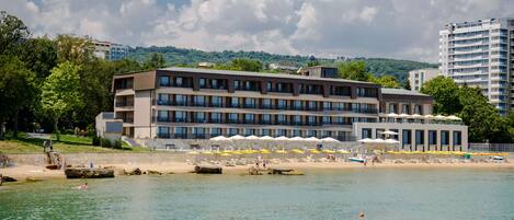 On the beach, sun loungers, beach umbrellas, beach towels