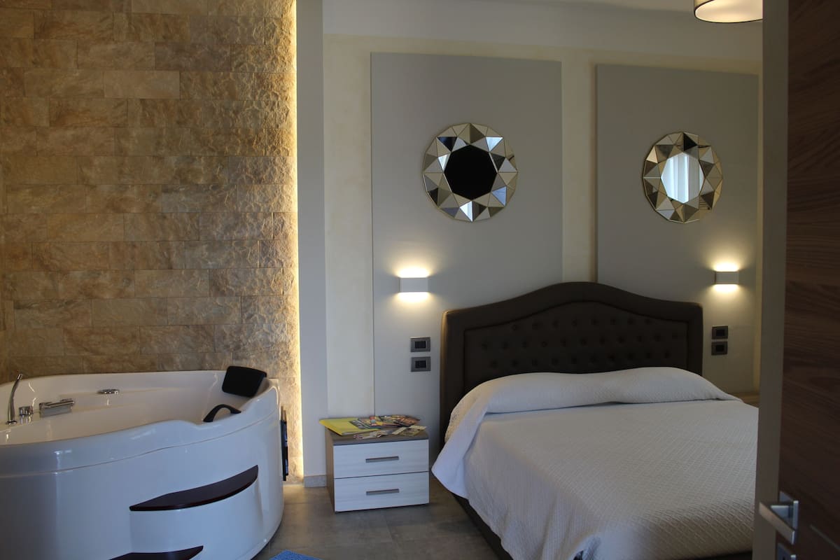 Deluxe Double Room, Jetted Tub | Iron/ironing board (on request), cots/infant beds, free WiFi