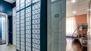 A hotel corridor with a blue wall and a door labeled "906-A". - Mister Econom Hotel - Hostel (Lviv)